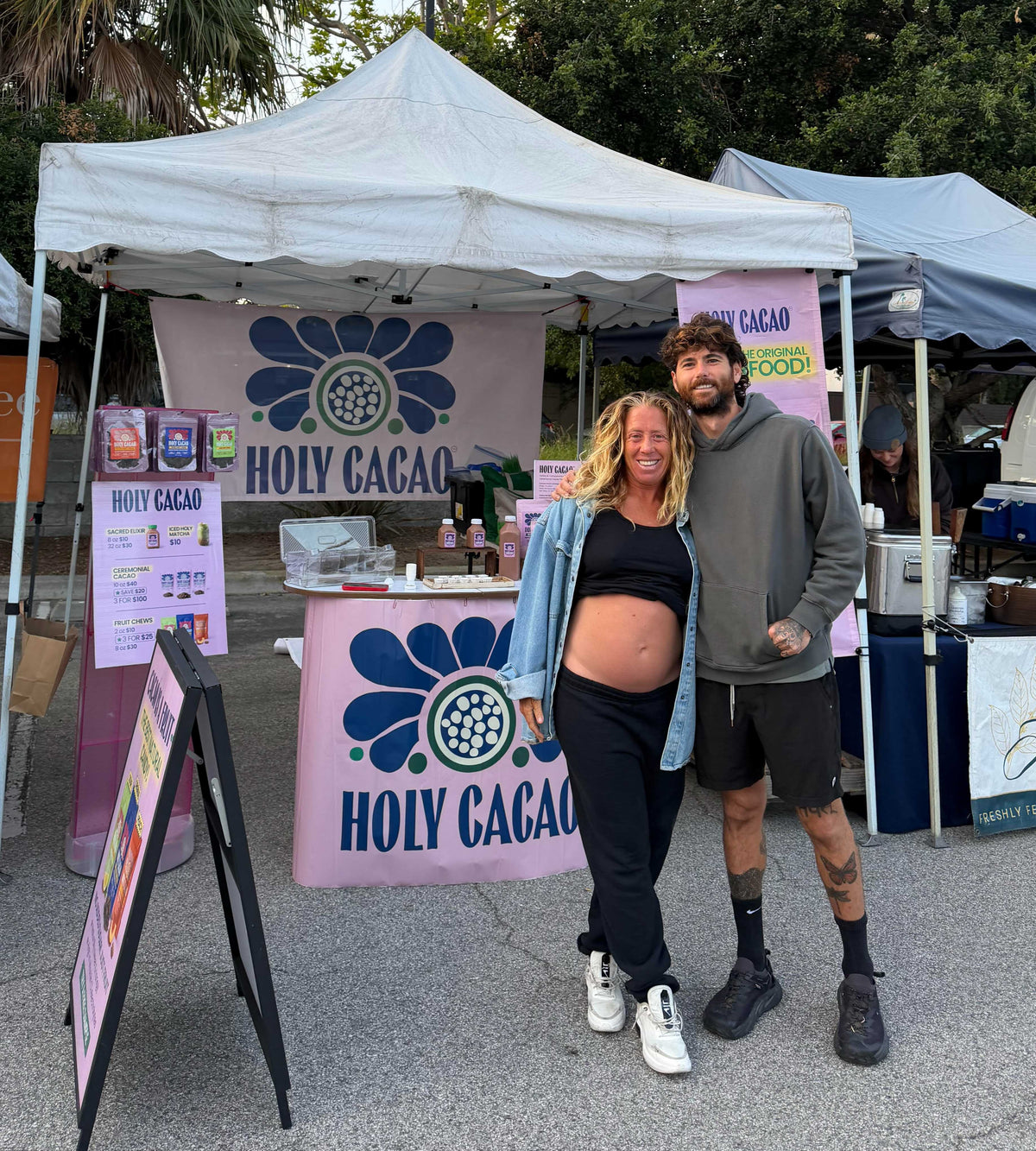 Leah and Blake at the Holy Cacao market booth